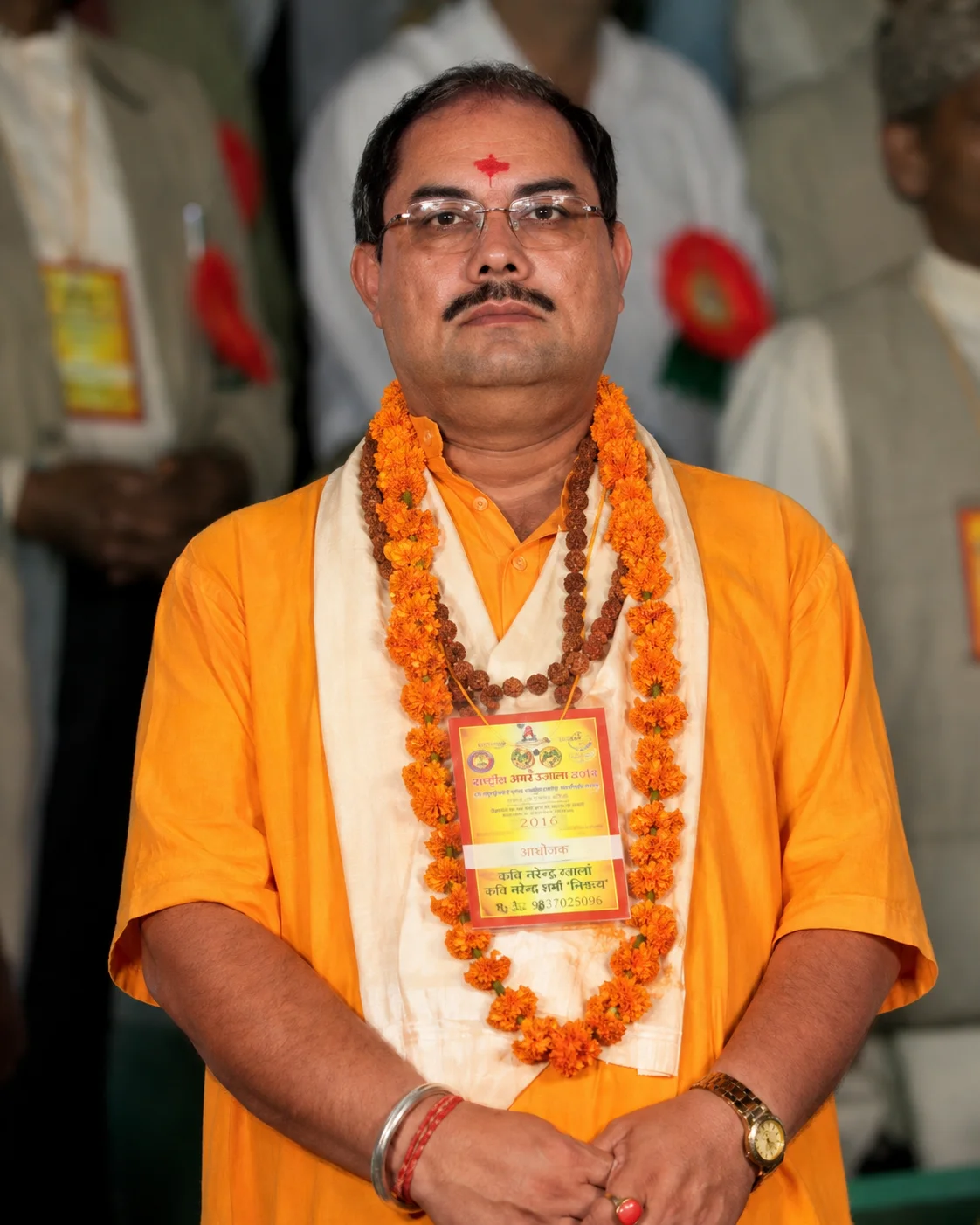 Pandit Rajkamal Shastri surrounded by traditional astrology books